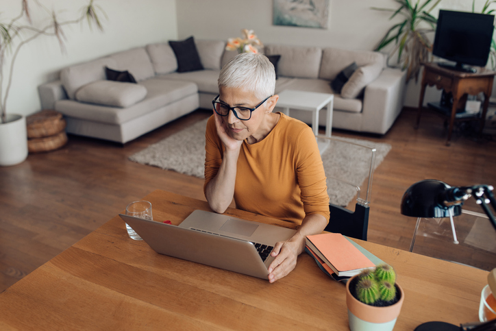 A borrower looking up the Rule of 78 to determine how much she could pay on a loan.