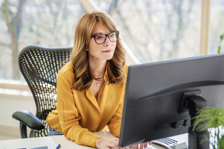 A woman reviewing her high-deductible health plan.