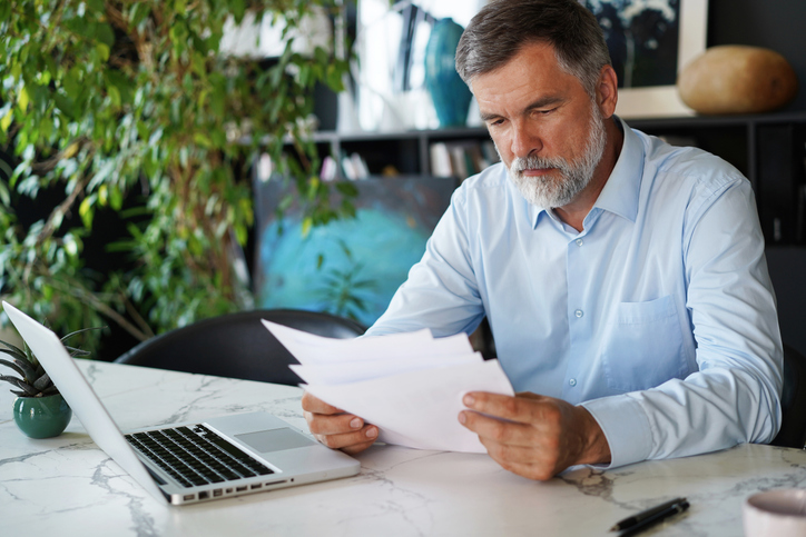 A man reviewing his deferred compensation plan.