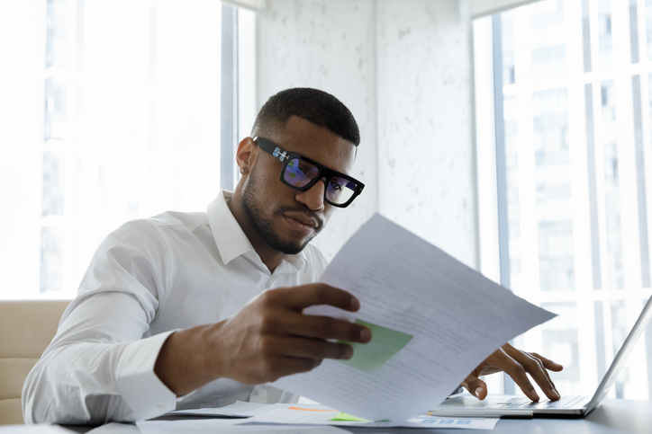 A man reviewing required documents for a small estate affidavit in Wisconsin.