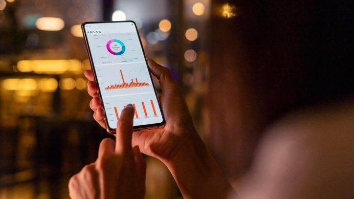 An investor reviews the performance of a REIT that she owns and decides whether to sell it or not.