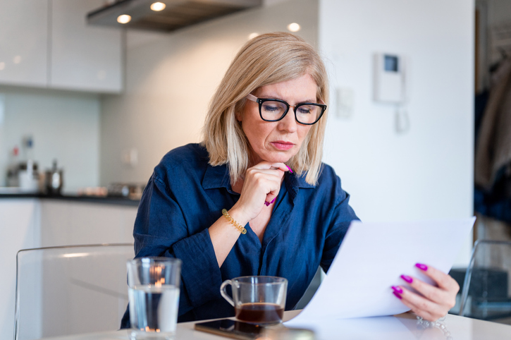 A woman reviewing deferred compensation options.