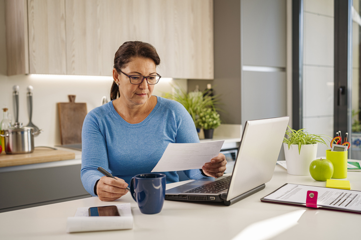 A woman reviewing documents for her estate plan in Utah.