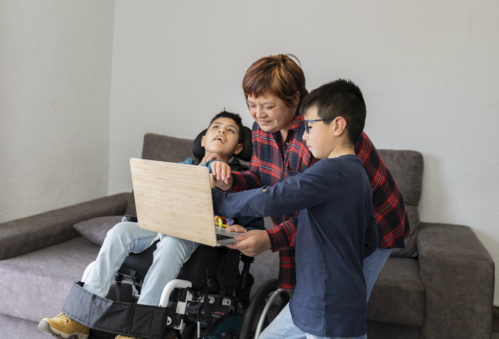 The mom thinking about estate planning for her paraplegic son in a wheelchair.
