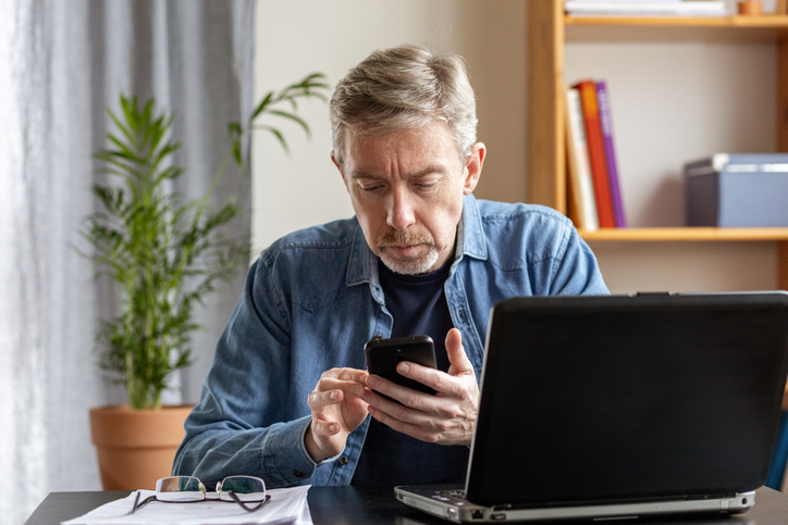 An investor researching the differences between mutual funds and ETFs.