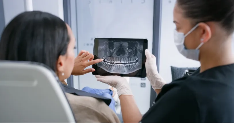 A woman using her HSA to pay for dental expenses.