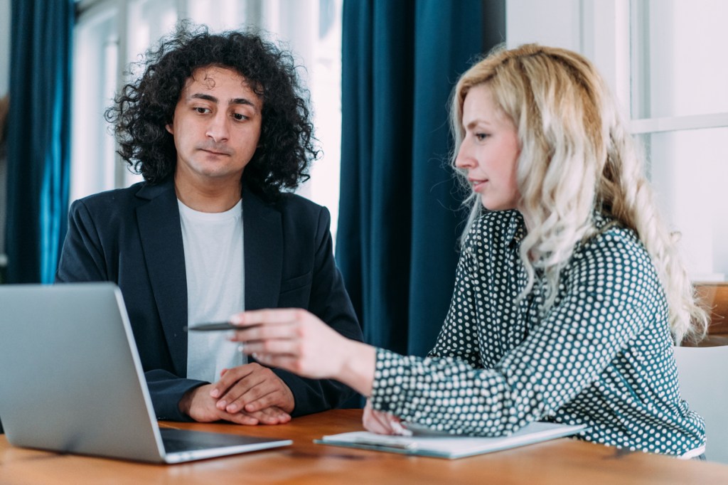 Real estate investors reviewing their portfolio.