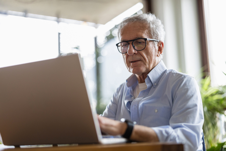 A senior tracking his retirement budget to avoid lifestyle creep.