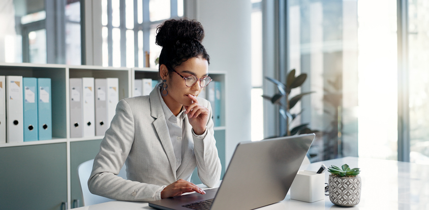 A woman reviewing her financial plan.