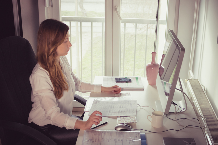 An investor using the enterprise value formula to determine the total value of a company.