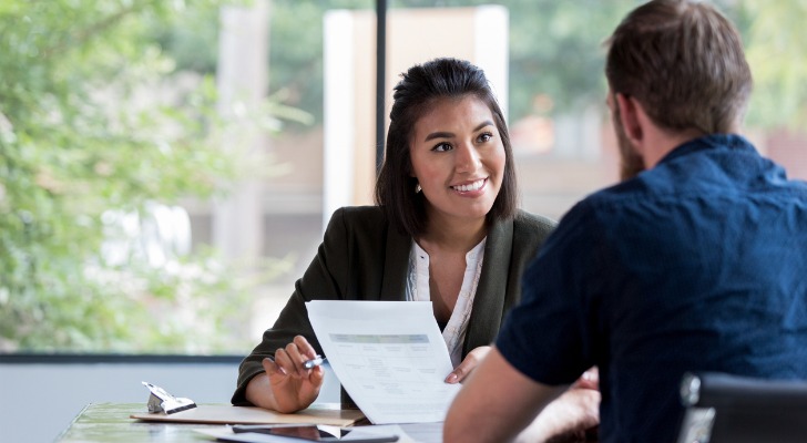 A woman meets with a client.