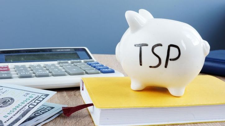The letters "TSP" written on a piggy bank.
