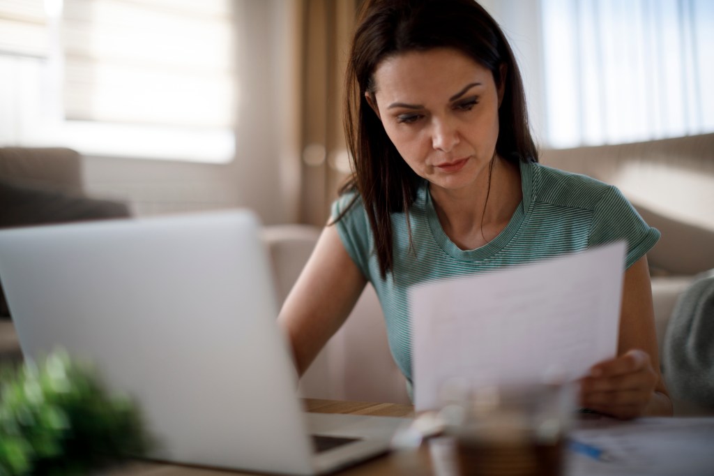 An investor reviewing recession-proof stocks.