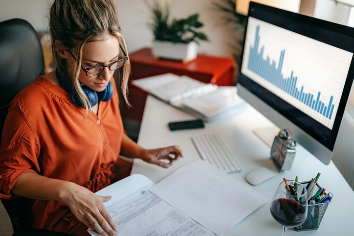 An investor reviewing the returns of her investment portfolio.