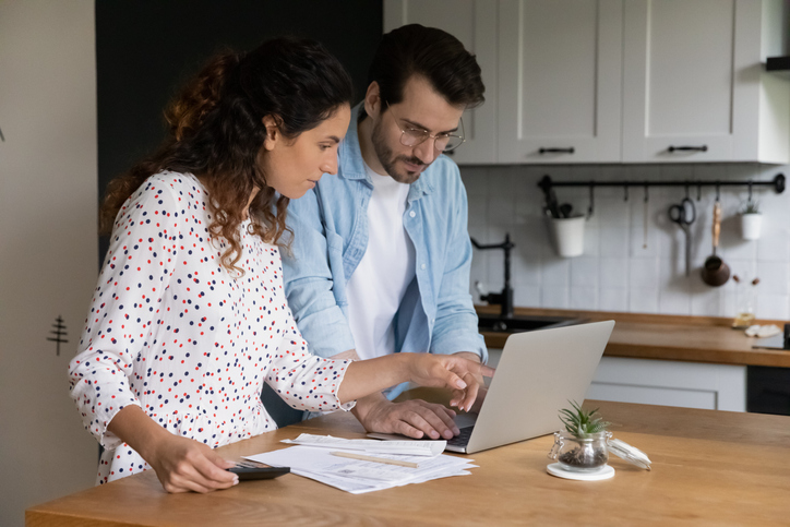 A couple reviews a portfolio with I Bond investments.