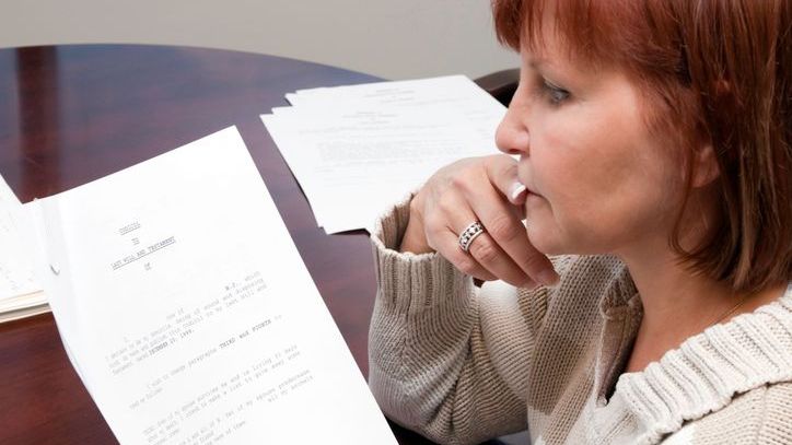 A woman makes changes to her will using a codicil.