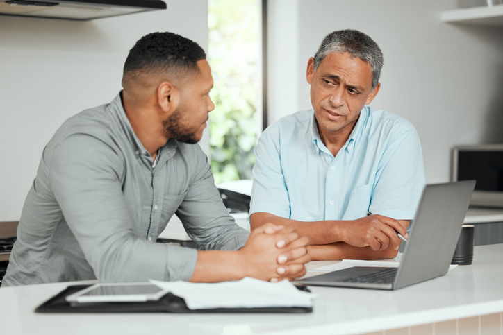 A man meeting with an estate planning attorney to discuss a codicil for his will.