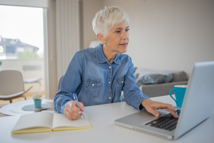 A woman comparing different powers of attorney in New Jersey.
