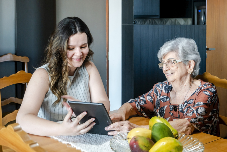 A senior creating an estate plan with her granddaughter.
