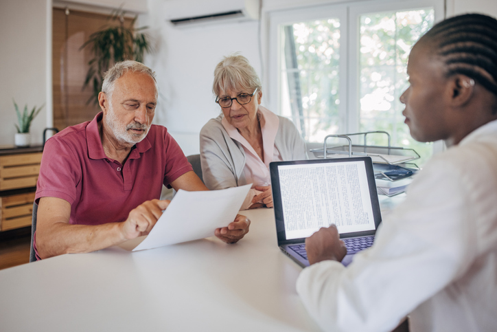 A senior couple reviewing an estate plan.