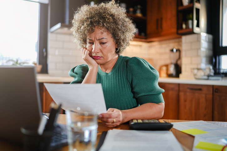 A woman reading the legal document for a power of attorney.