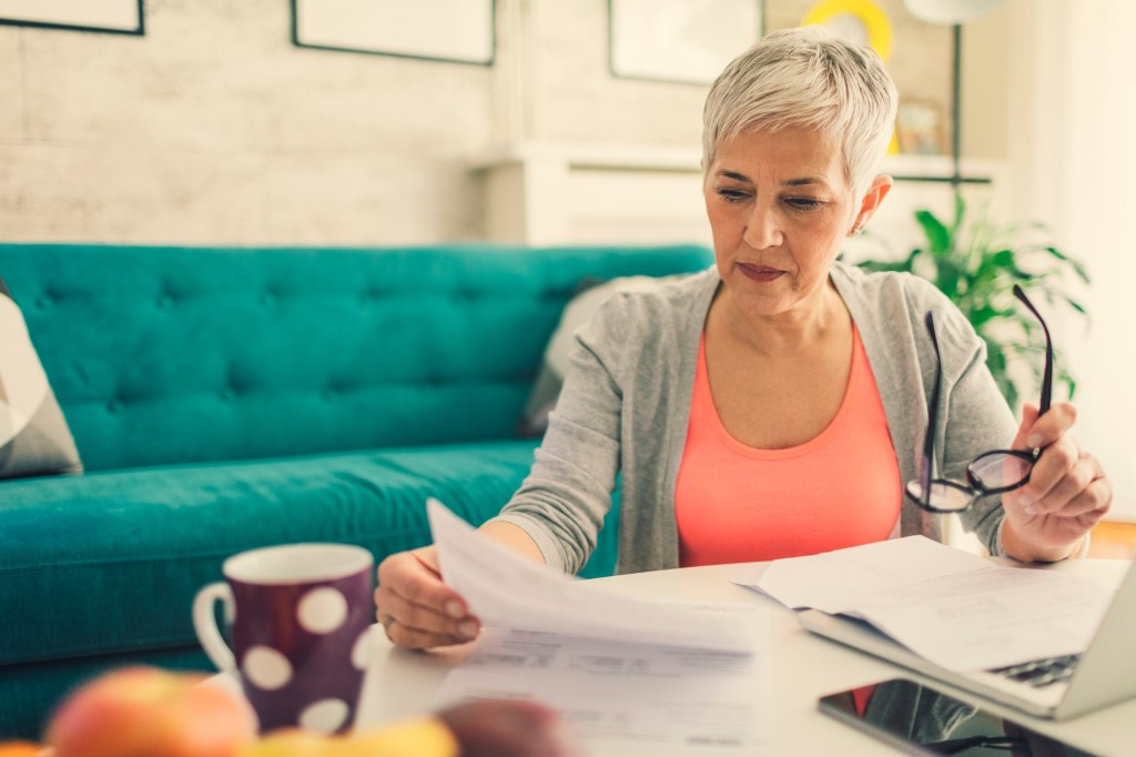 A woman calculating how much she may owe in gift taxes.