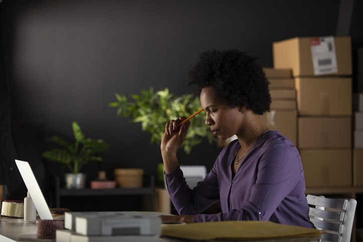 A woman researching tips for creating a financial safety net.