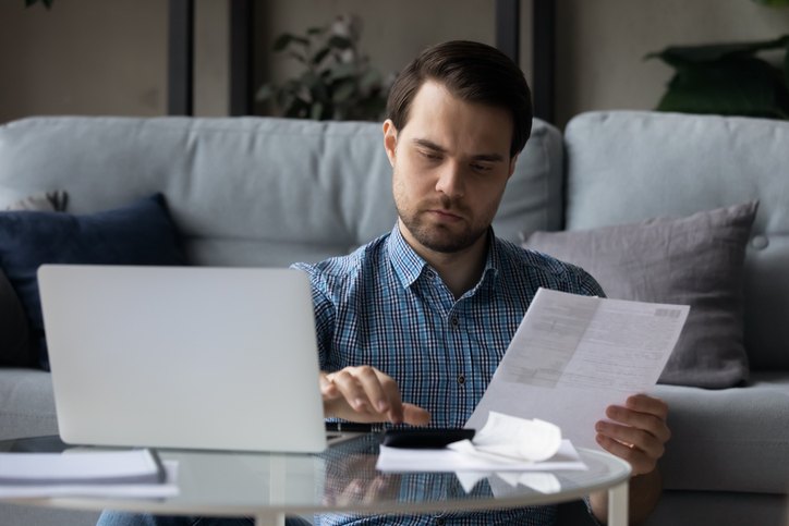 A man calculating the high-low method.