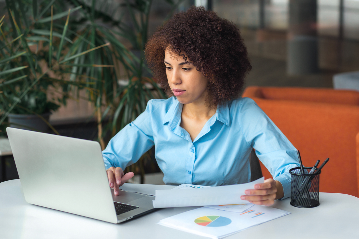 A woman reviewing how the switch of her financial advisor to another firm could impact her.