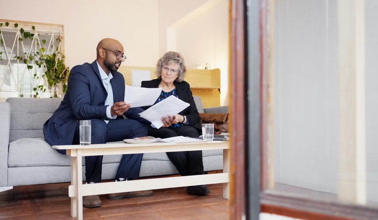 A senior meeting with a retirement planning advisor.