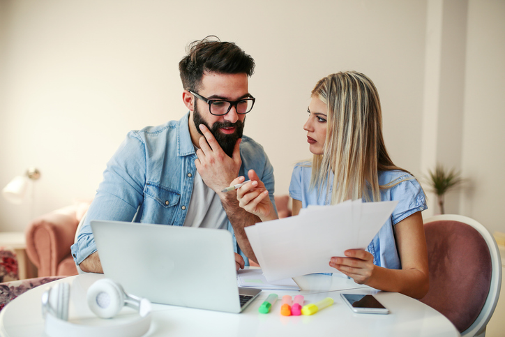 A couple discussing ways to increase their home's value before an appraisal.