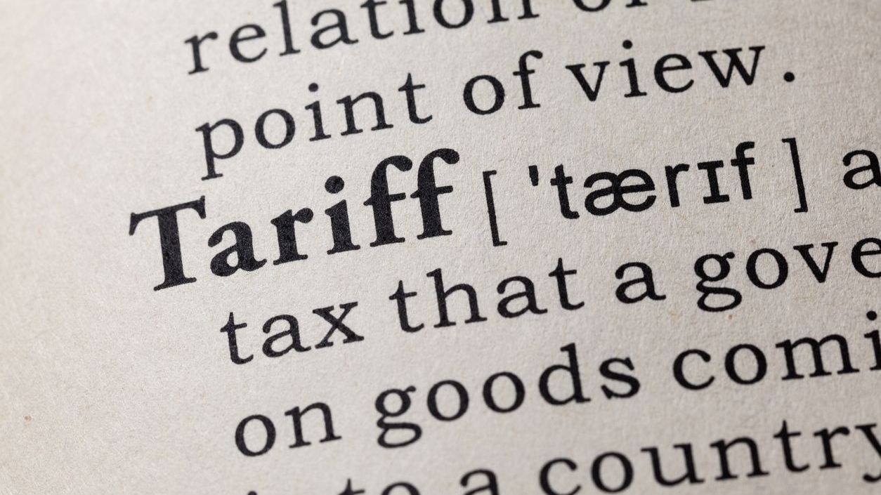 A close-up of a dictionary entry for the word "tariff."