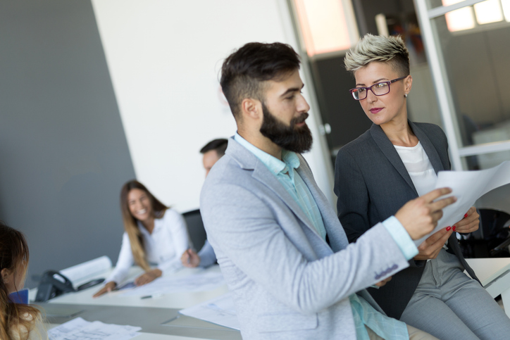 Financial advisors reviewing documents for their Form ADV.
