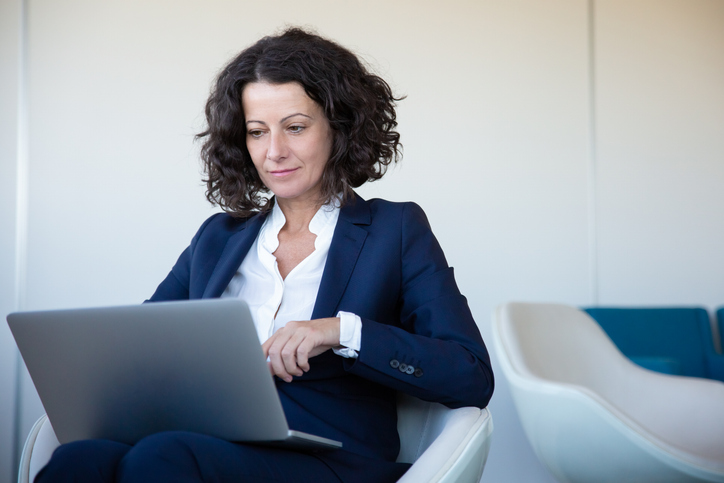 A woman rebalancing her retirement plan.