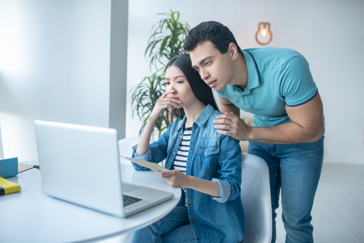 A couple reviewing their investment portfolio.