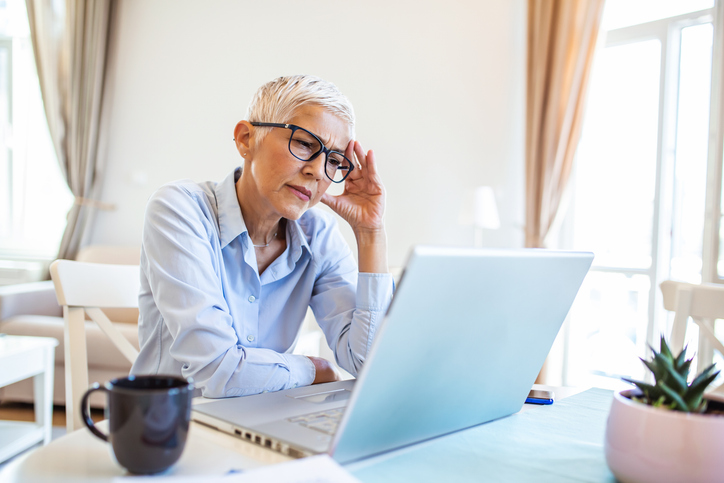 An investor looking up different types of tariffs that governments can place on imported goods.