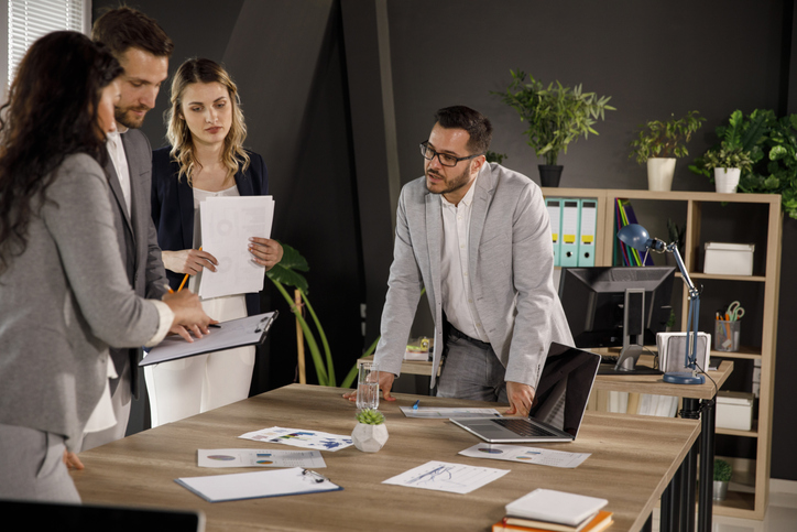 Financial advisors discussing different parts of the Form ADV.