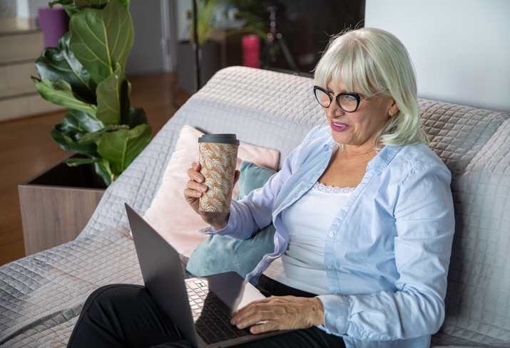 A woman looking up how to avoid common Social Security mistakes.