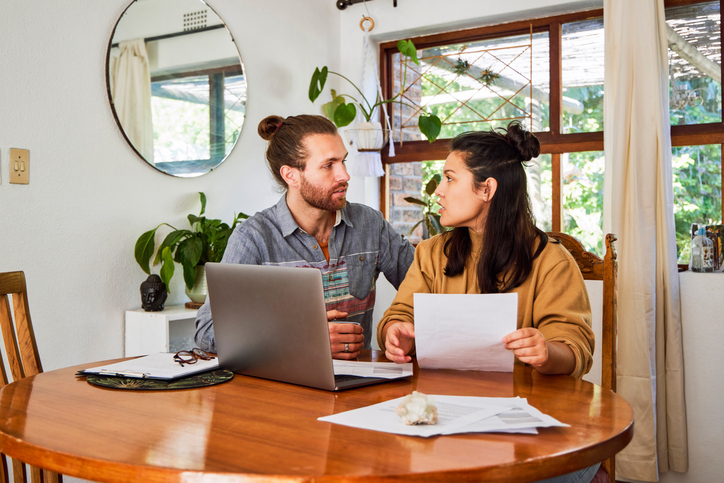 A divorced couple discussing debt obligations.