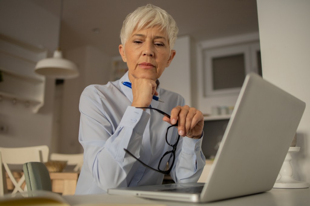 A woman thinking about her retirement goals.