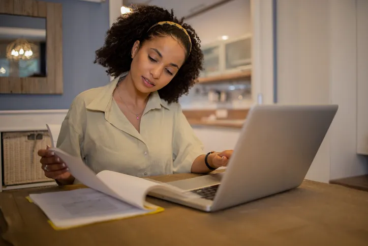 A woman researching how long it takes to withdraw from a 401(k).