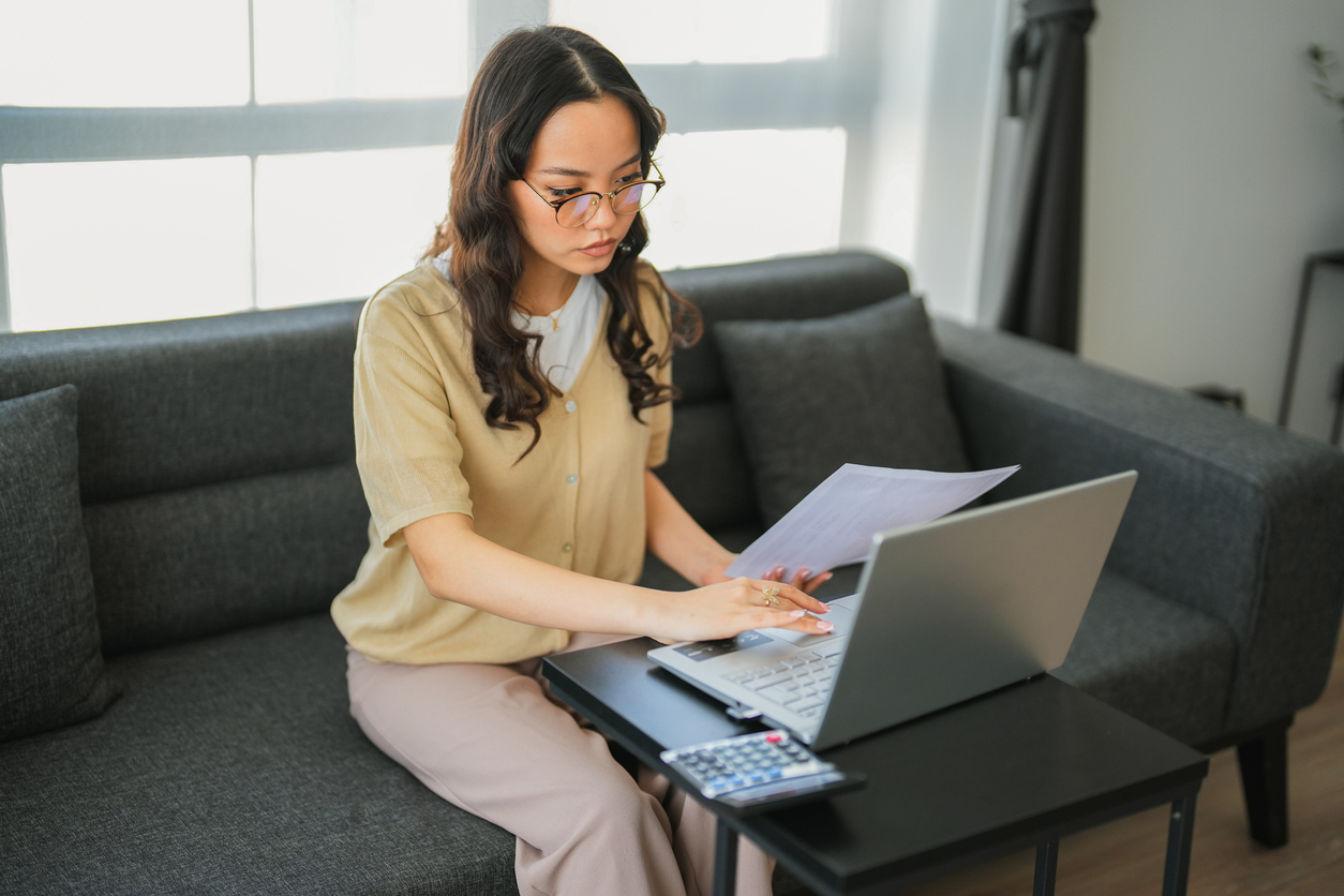 A woman reviewing her finances after getting divorced.