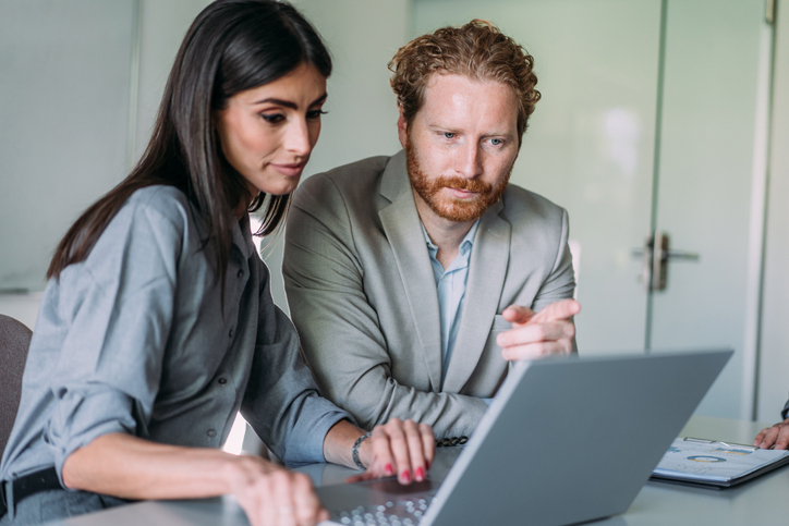 A couple reviewing their real estate investment portfolio.
