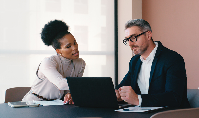 A client working with a financial advisor to create a financial plan to cover health insurance premiums in early retirement.