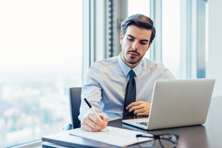 An advisor works on repapering their firm.