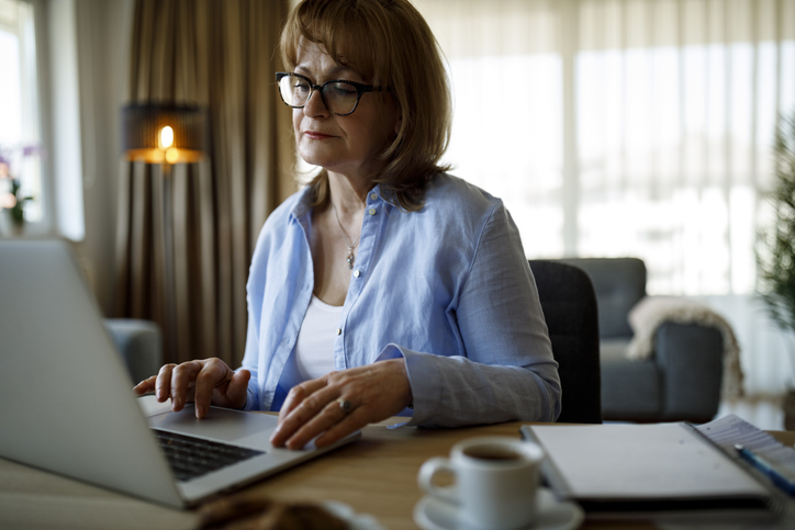 A woman reviews her investment portfolio.