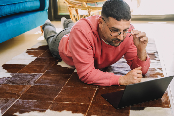 An investor reviewing an investment strategy in his apartment.