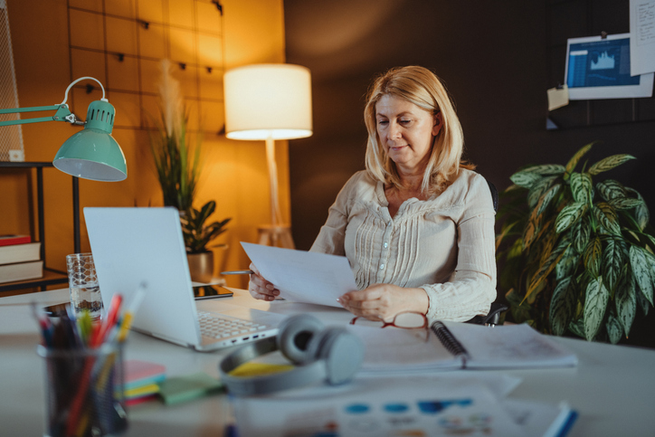 A woman reviewing the interest accumulated in her deferred annuity.