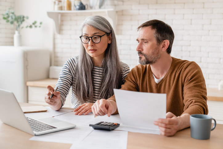 A couple preparing their taxes.