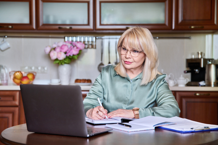 A woman reviewing a tax plan for her portfolio.